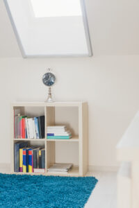 bedroom skylight ideas that accentuates a bookcase