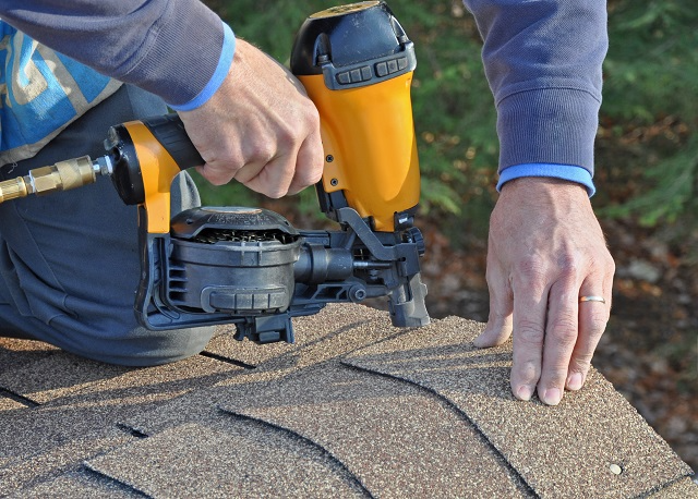 Installing roof shingles with a roofing nail gun